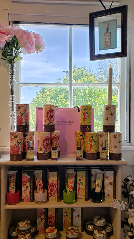 A candle display in front of a window